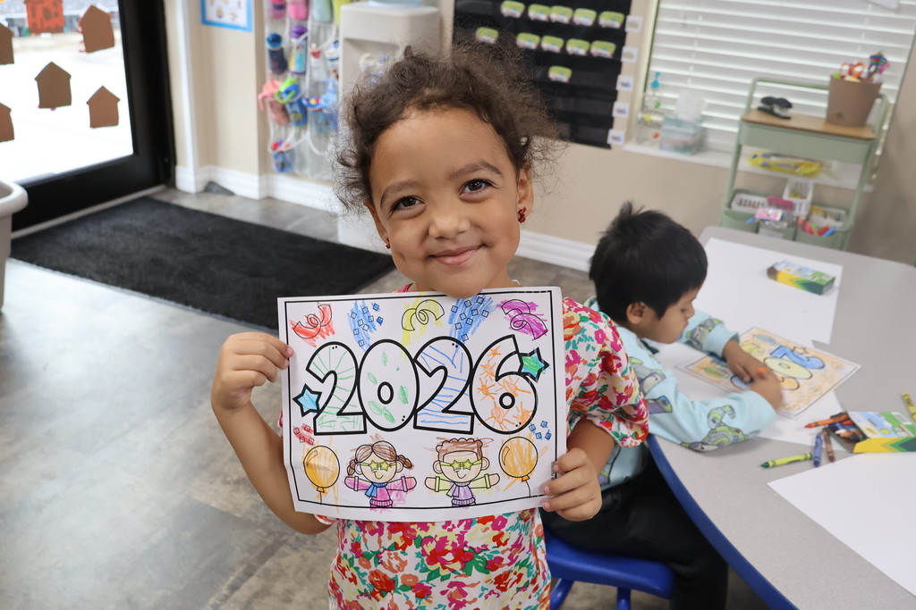 student holding 2026 coloring page 