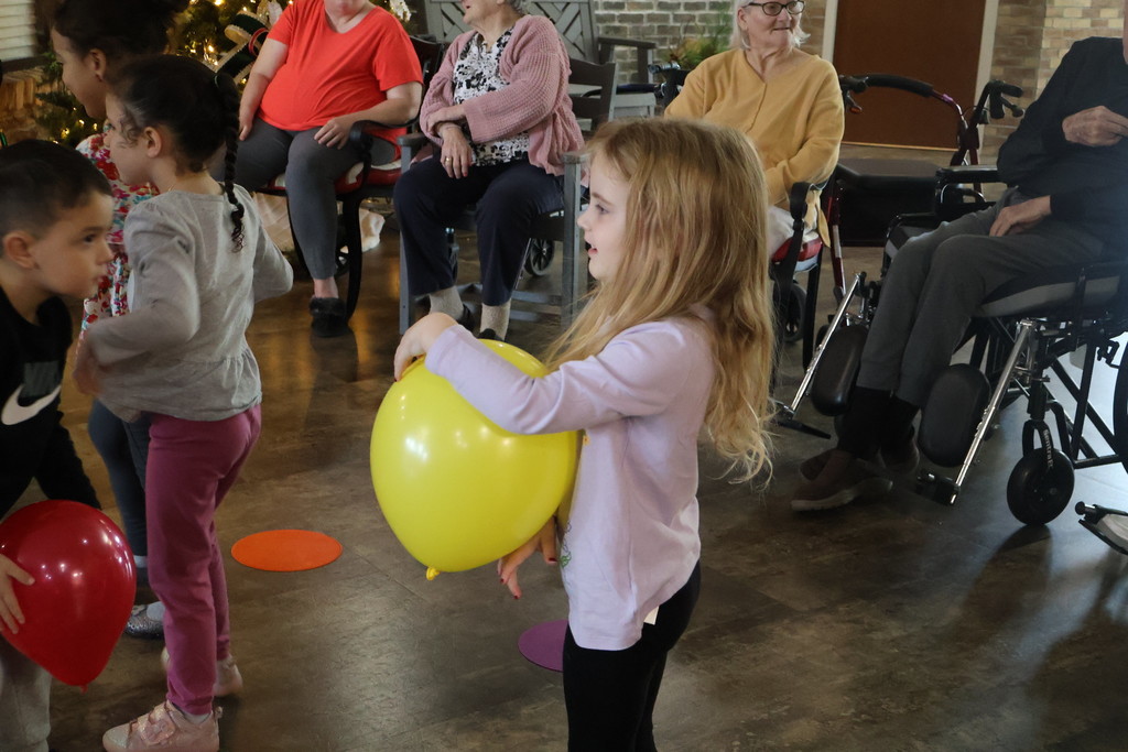 students playing with balloons 