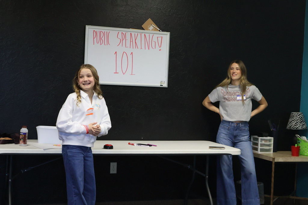 students smiling public speaking