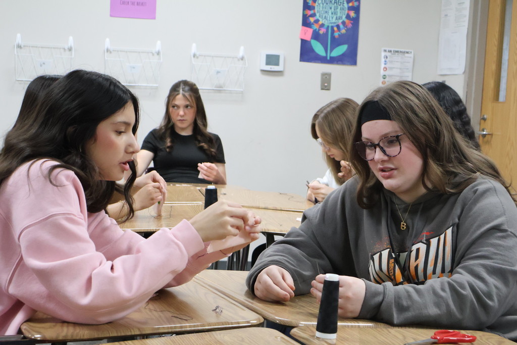 student sewing 
