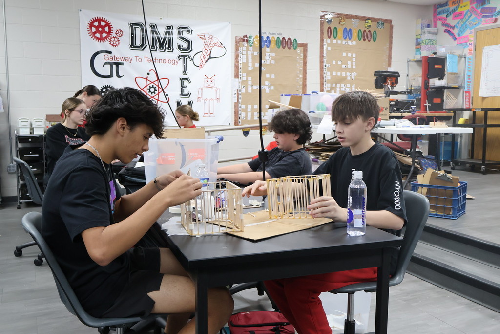 student building houses 