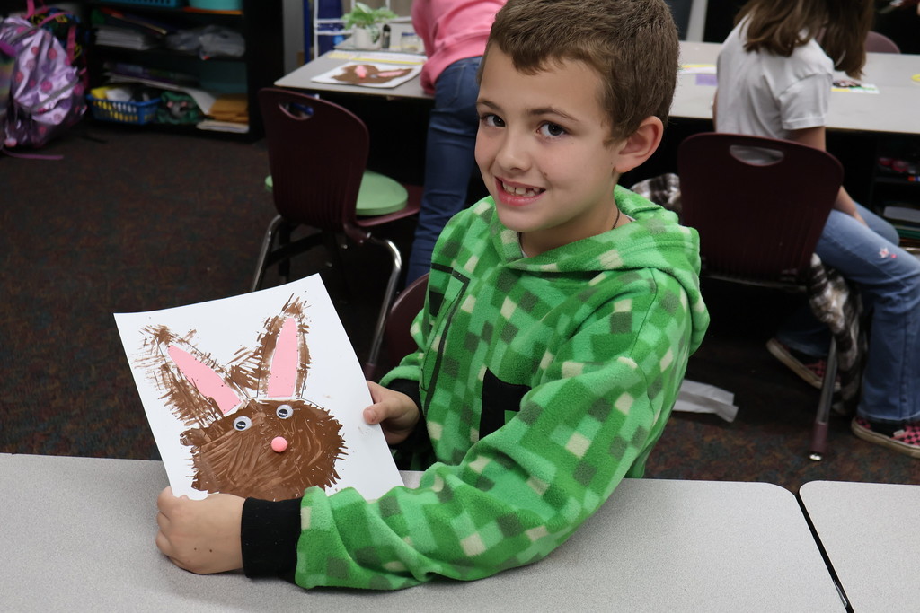 student showing artwork