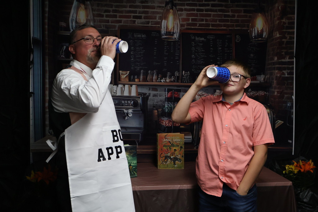 student posing for photo with teacher