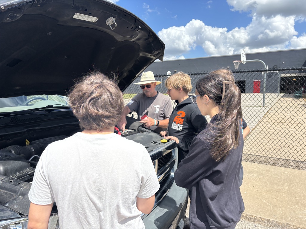 student learning about a vehicle