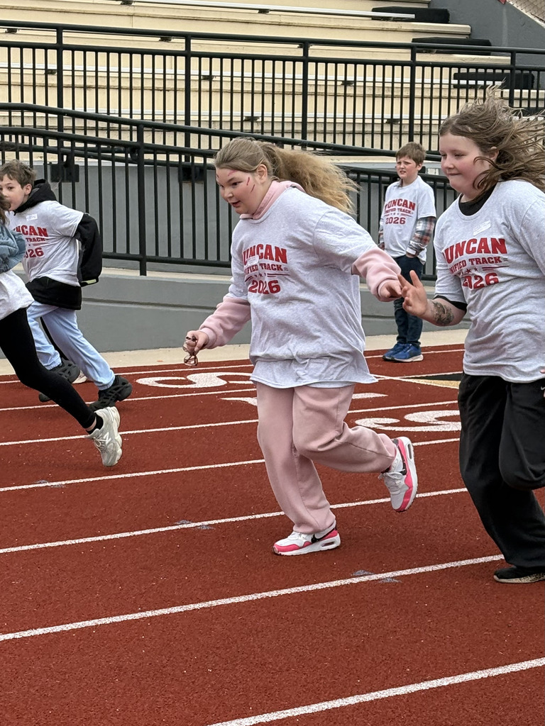 students running track 