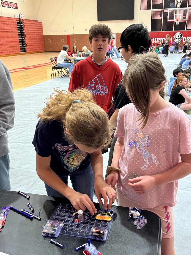 Students participating in industry tours at their stations