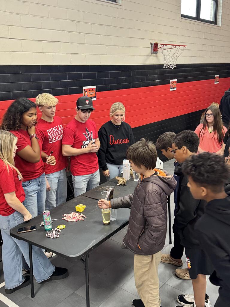 Students participating in industry tours at their stations