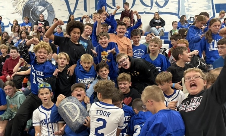 7th grade students holding the spirit jug!