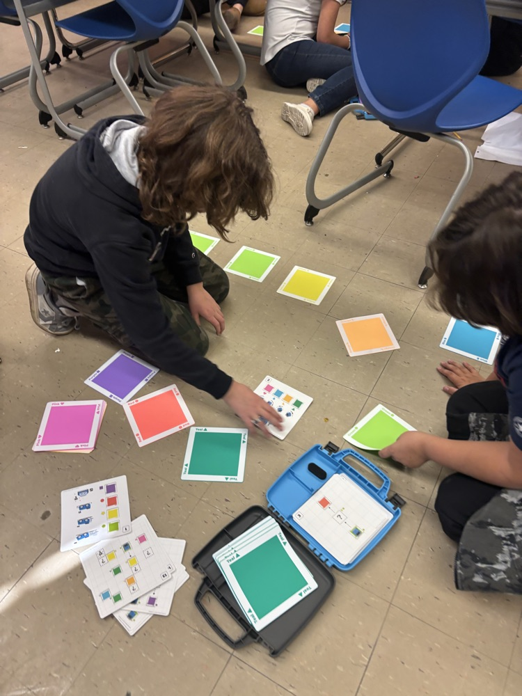 Using the pattern cards to create a maze.
