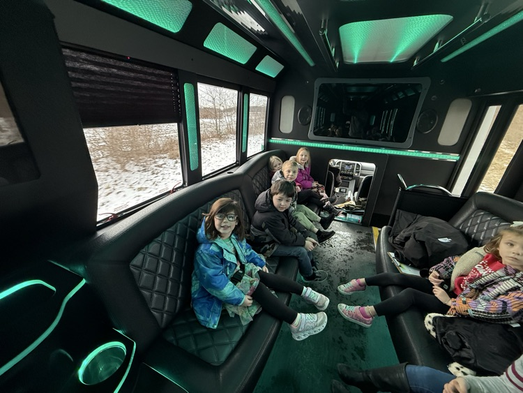 students on limo ride