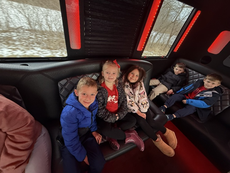 students on limo ride