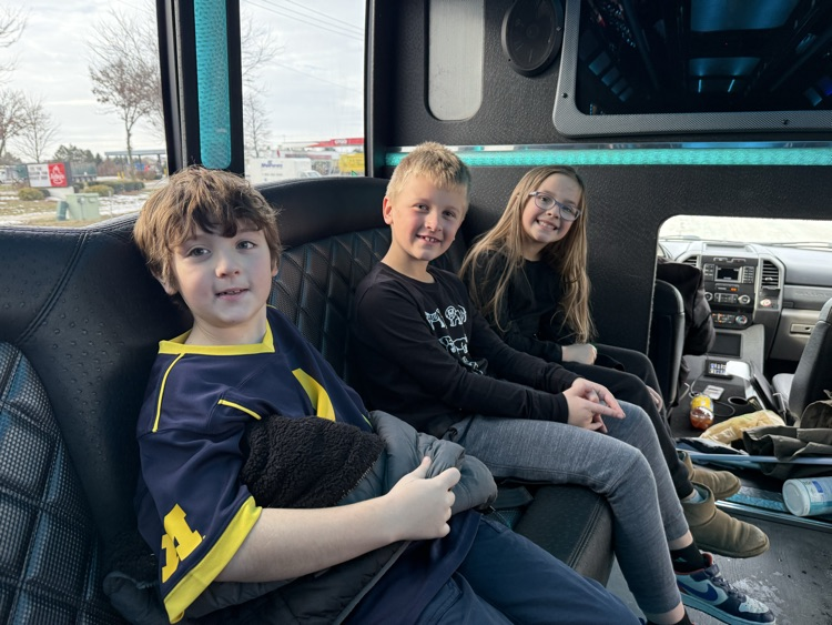 students on limo ride