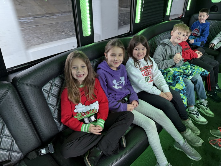 students on limo ride