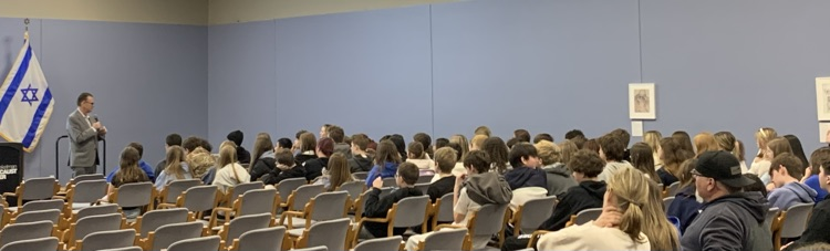 listening to the speaker