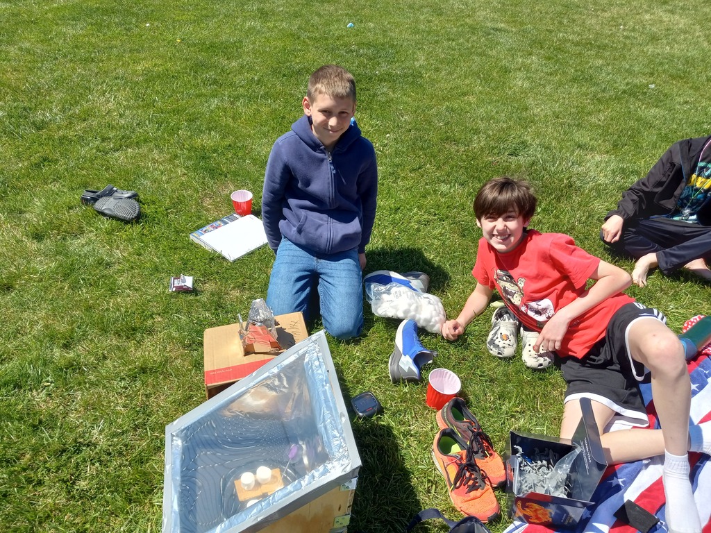 Students testing out their solar ovens at the solar cookout. This oven was our top temp winner, with the highest temperature reading aver 200 degrees Fahrenheit!