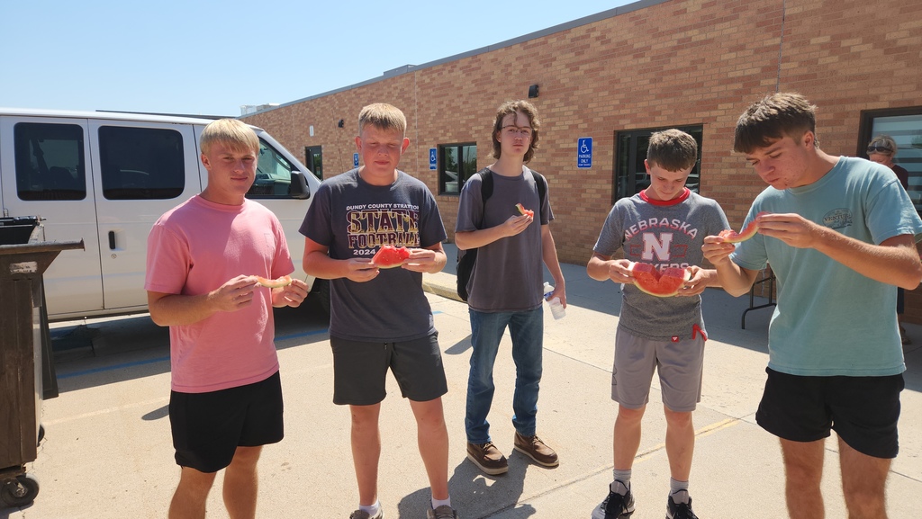 Boys eating watermelon