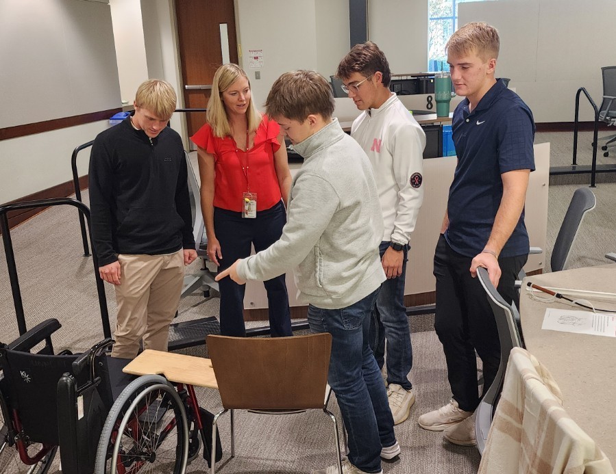 4 students problem solving with an occupational 