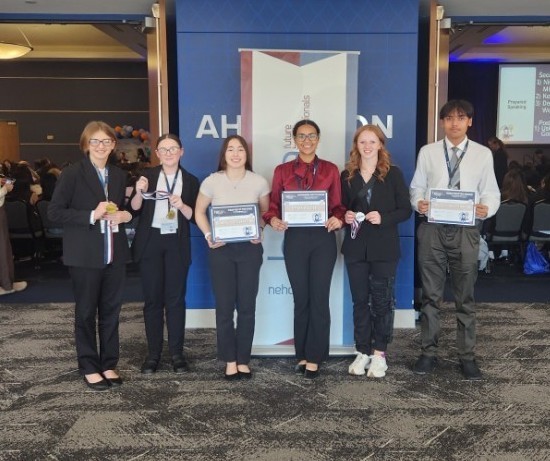 group of students holding their awards