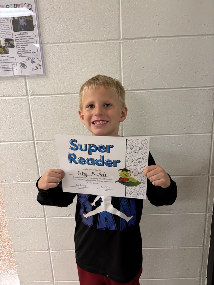 Toby holding reading award