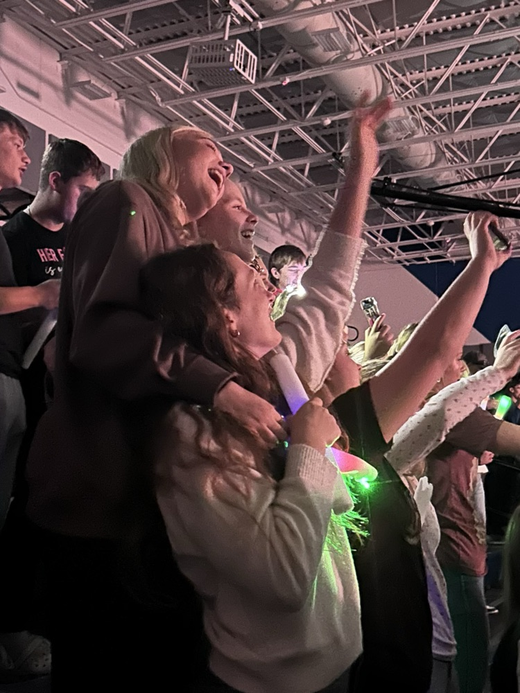 A group of female students singing together