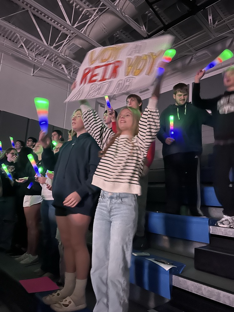 A female student holds a poster during the concert 