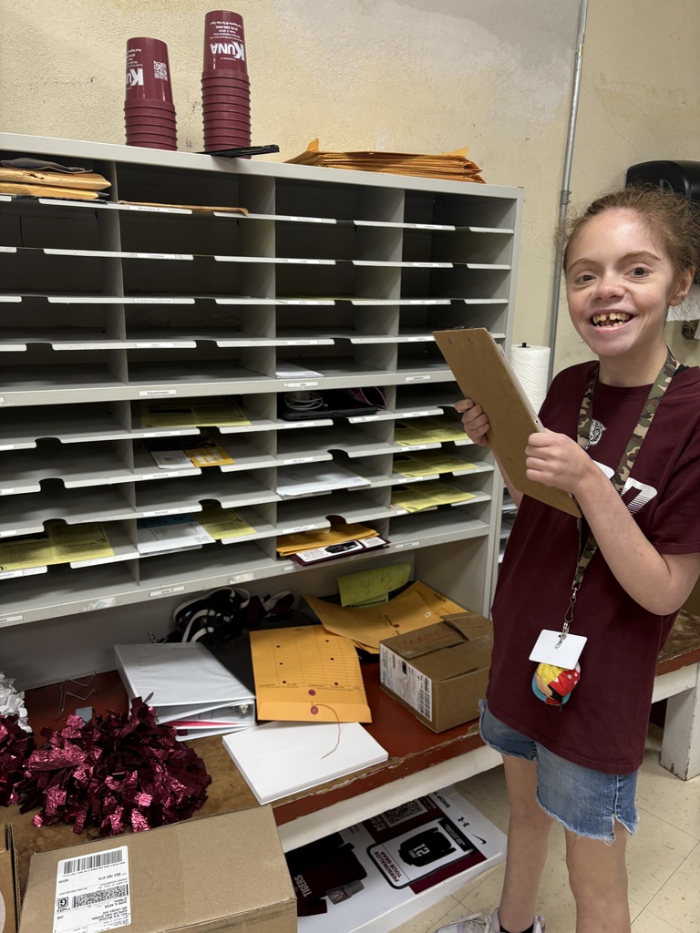 Kady using her clipboard to make sure she checks everyone's box for mail. 