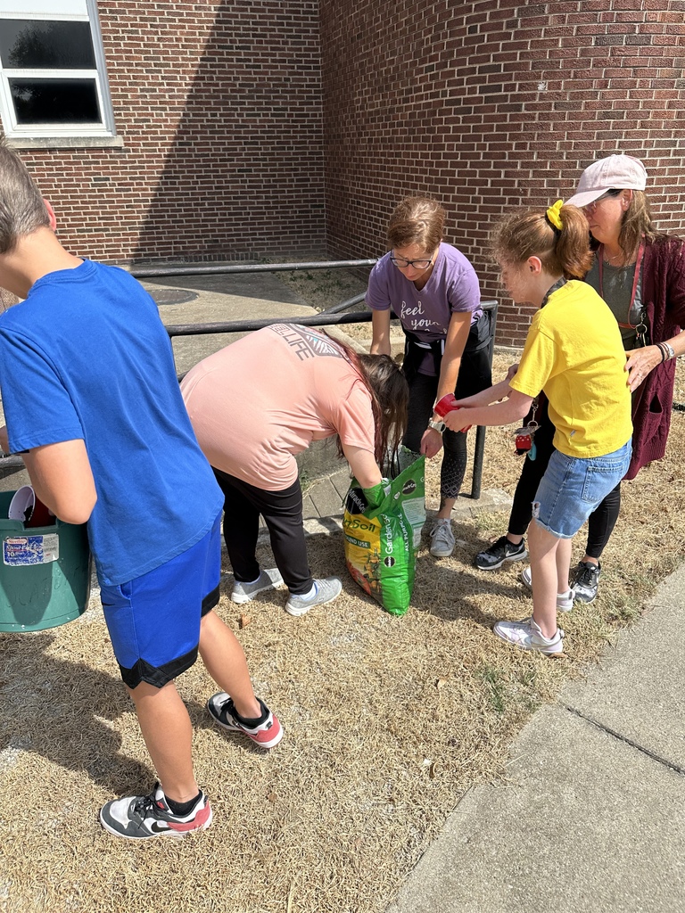Students mixing different types of soil for the best mix. 