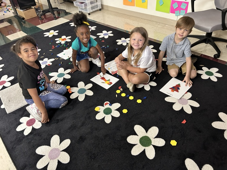 students in on rug