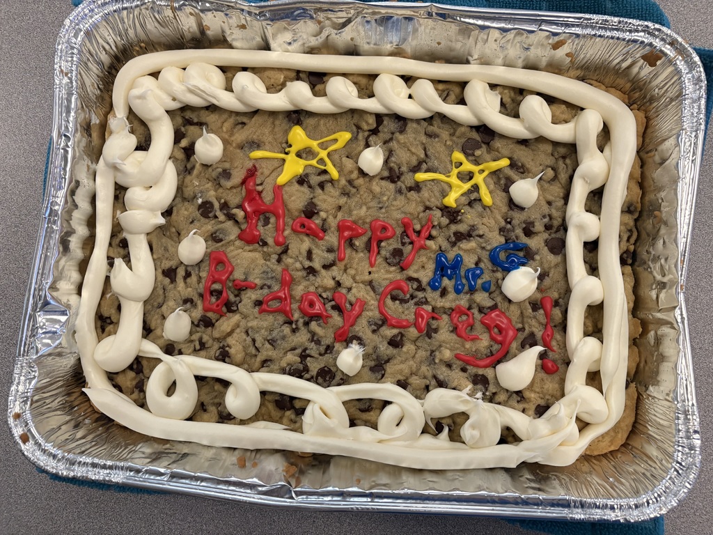 Cookie Cake that was baked by the students with the writing "Happy B-day Creg and Mr. G!"