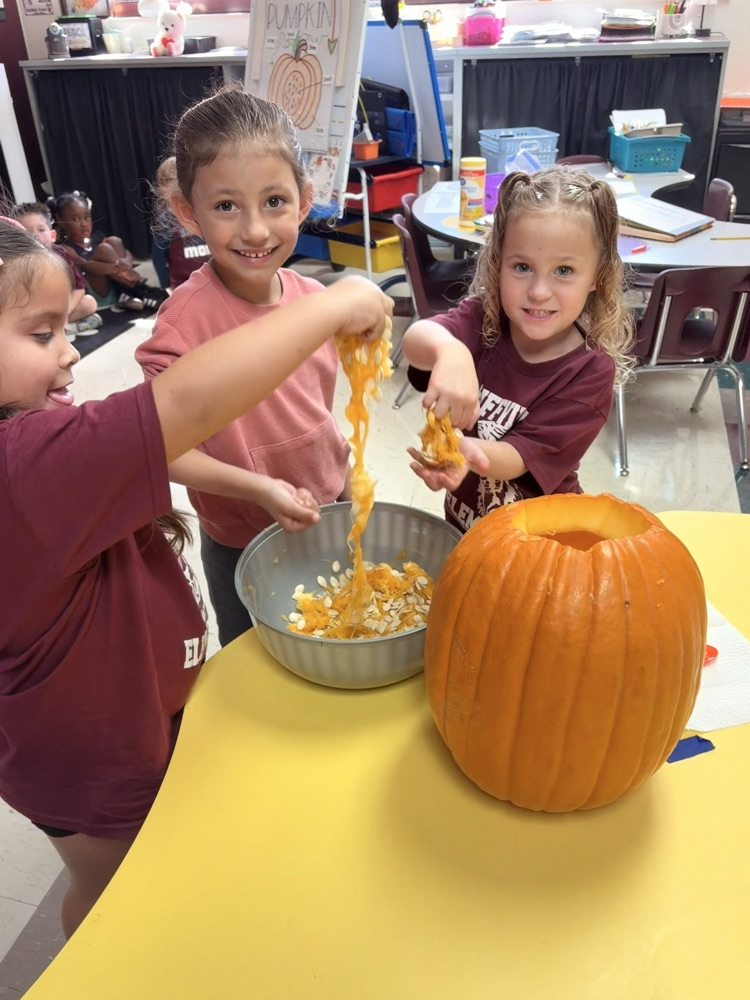 children exploring a pumpkin