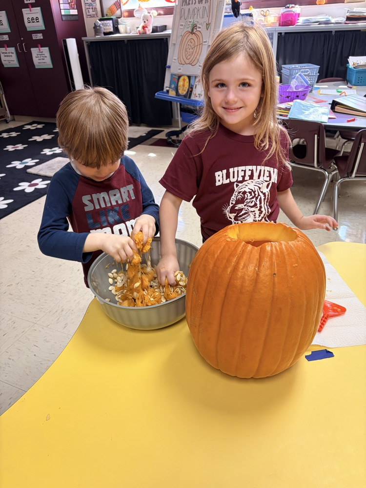 children exploring a pumpkin