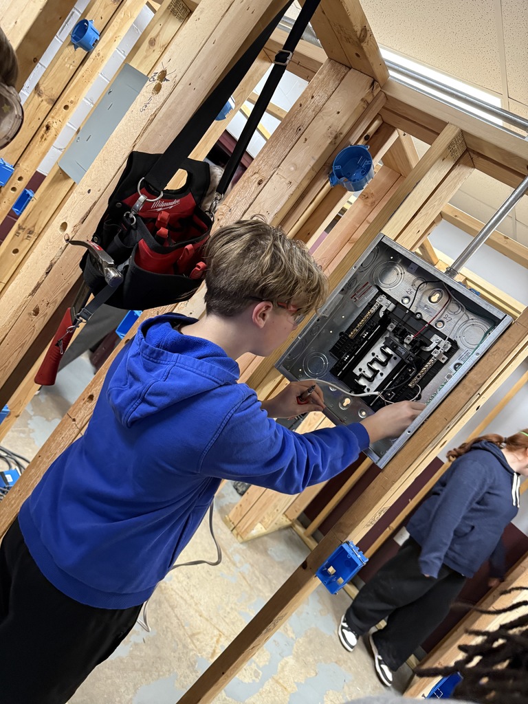 This STEM student just learned how to connect power into an electrical panel with JaMarion.