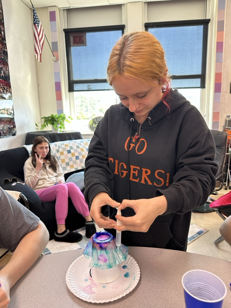 Students in the Tiger Success Center crafting ghosts made from coffee filters.