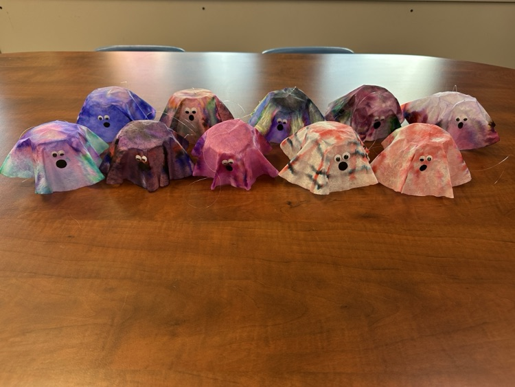 Students in the Tiger Success Center crafting ghosts made from coffee filters.