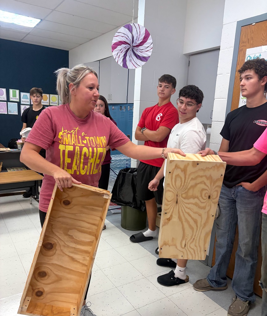 Miss Jill taking steps from high school students.