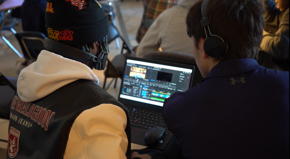 students looking on computer together
