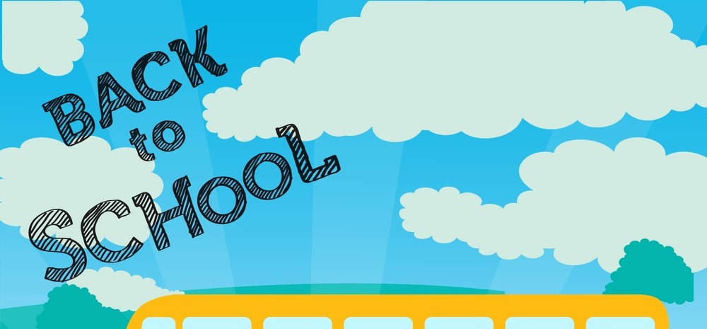 Back to school with clouds in the sky and the top of a school bus.
