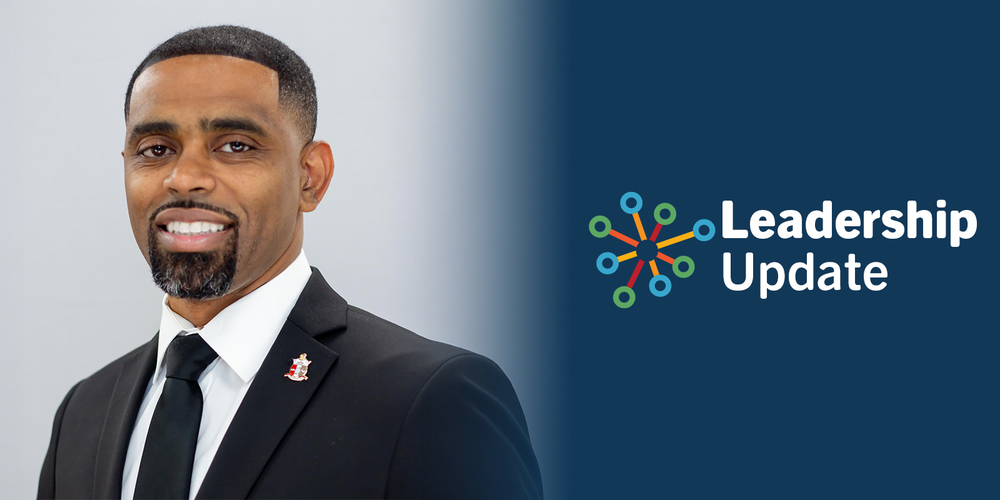 A man in a suit smiling confidently on the left, with "Leadership Update" text and a colorful network icon on a blue background on the right.