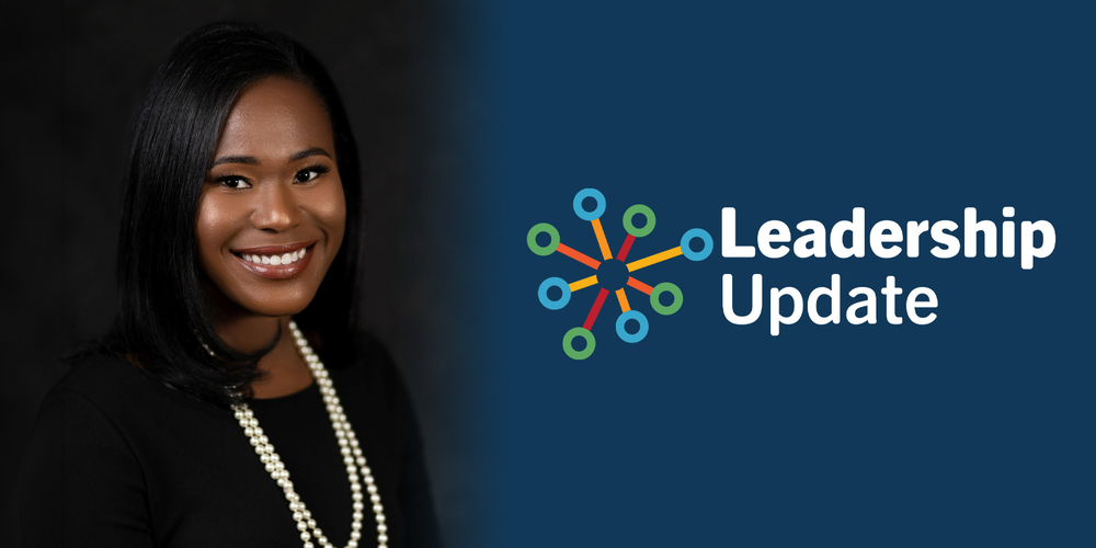 Smiling Black woman in black attire and pearls beside a colorful connected-node icon and “Leadership Update” text on a dark blue background.
