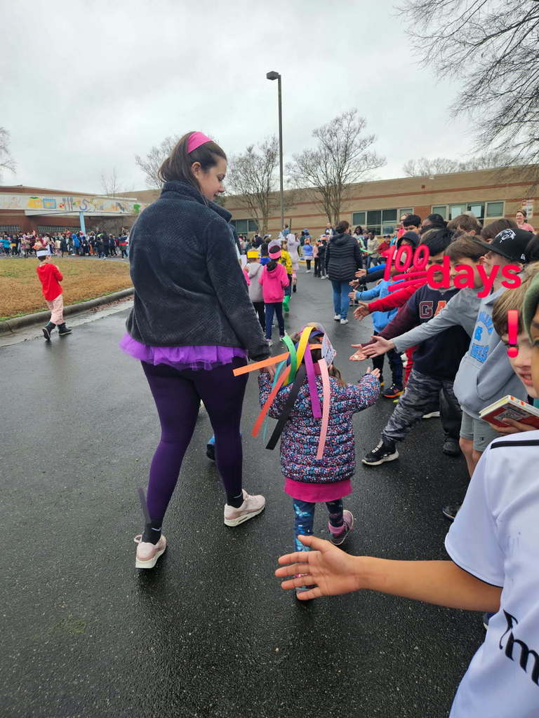 high fives at the 100 day parade