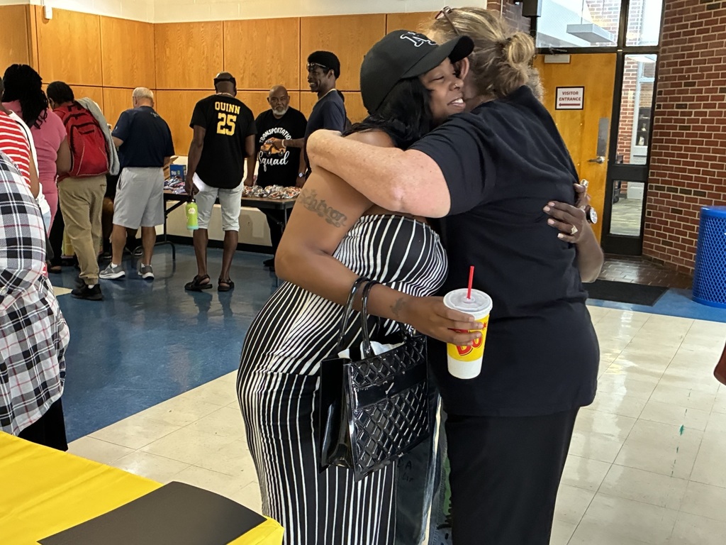 Bus drivers hugging
