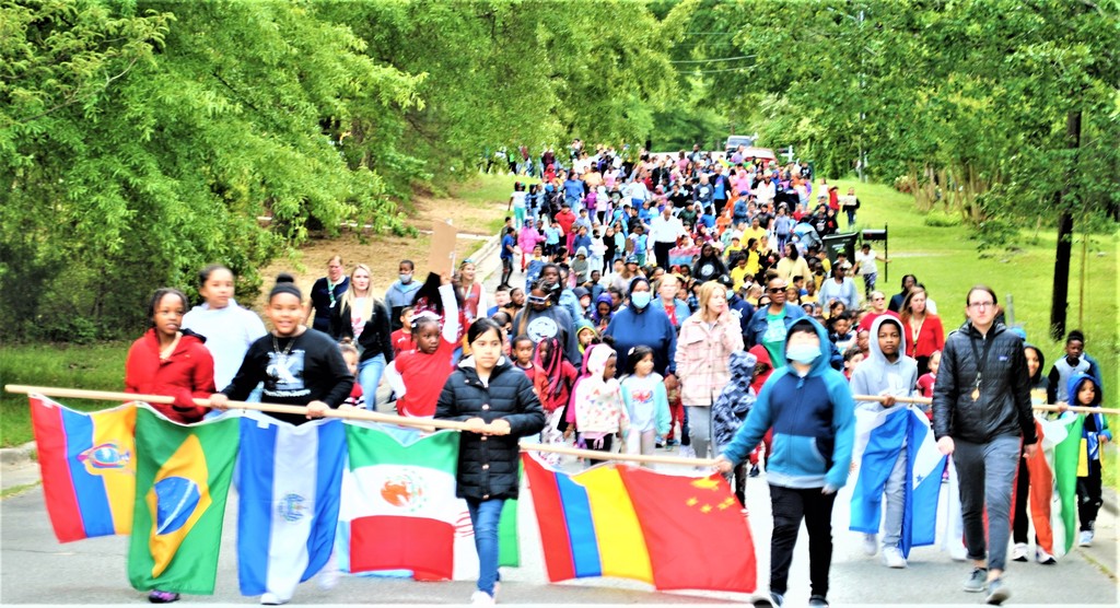 children walking with flags