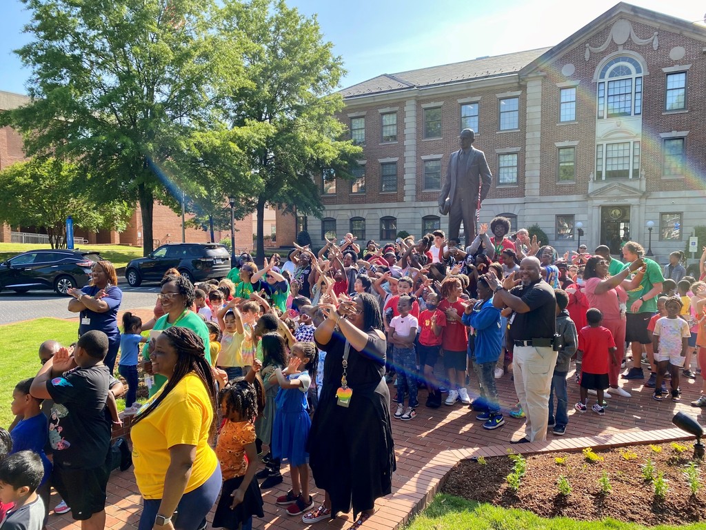 children and teachers at the NCCU Shepard statue