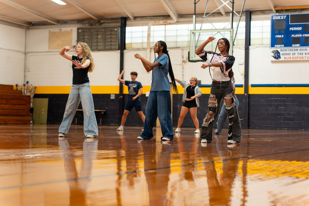 Students dancing in a gym