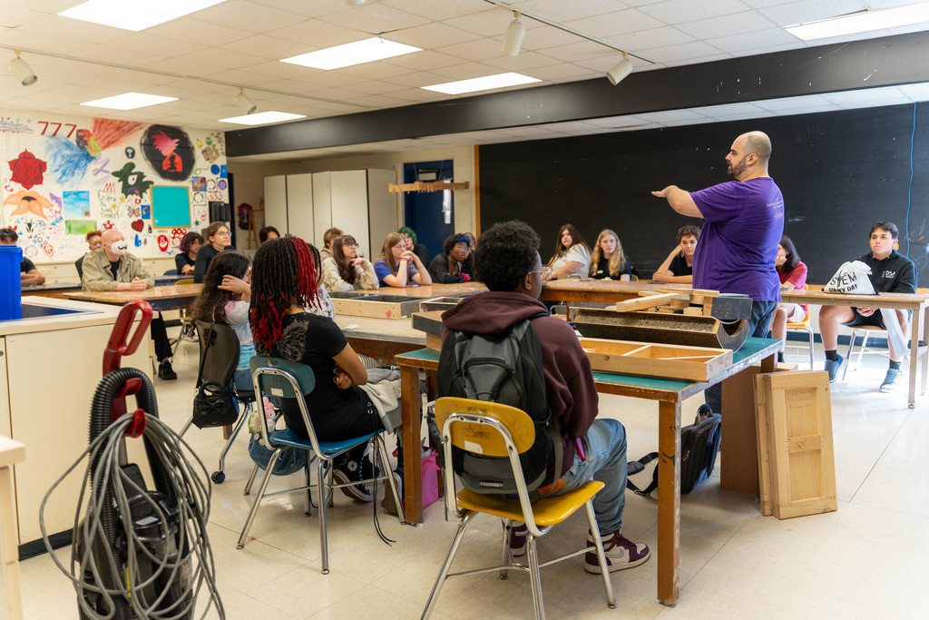 Students learning about plywood in a classroom