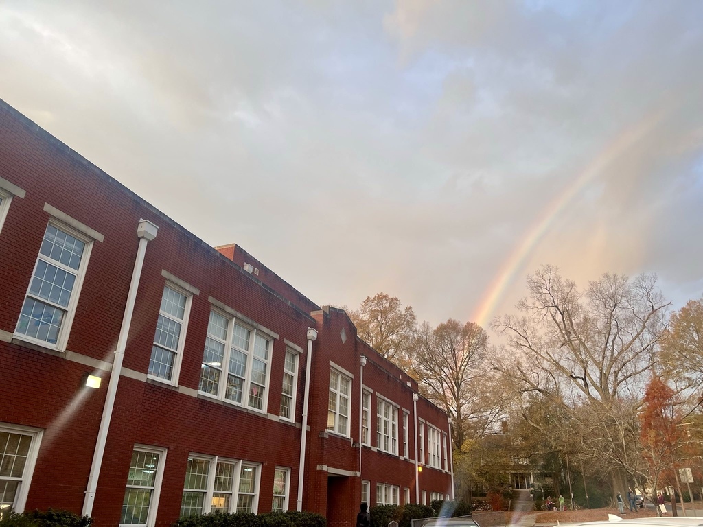 Picture of school with rainbow overhead