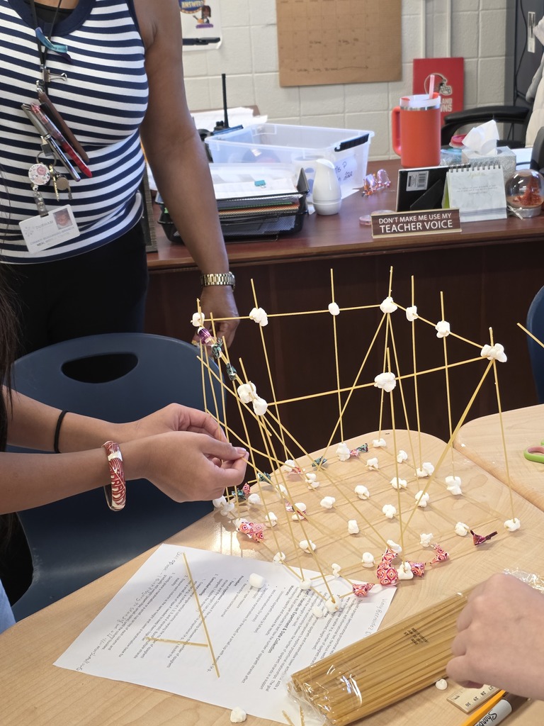 Students used spaghetti and marshmallows to design and build towers—testing how one variable proportionally affects another while applying evidence from the text to guide their decisions. The room was filled with collaboration, problem-solving, and lots of creative engineering!