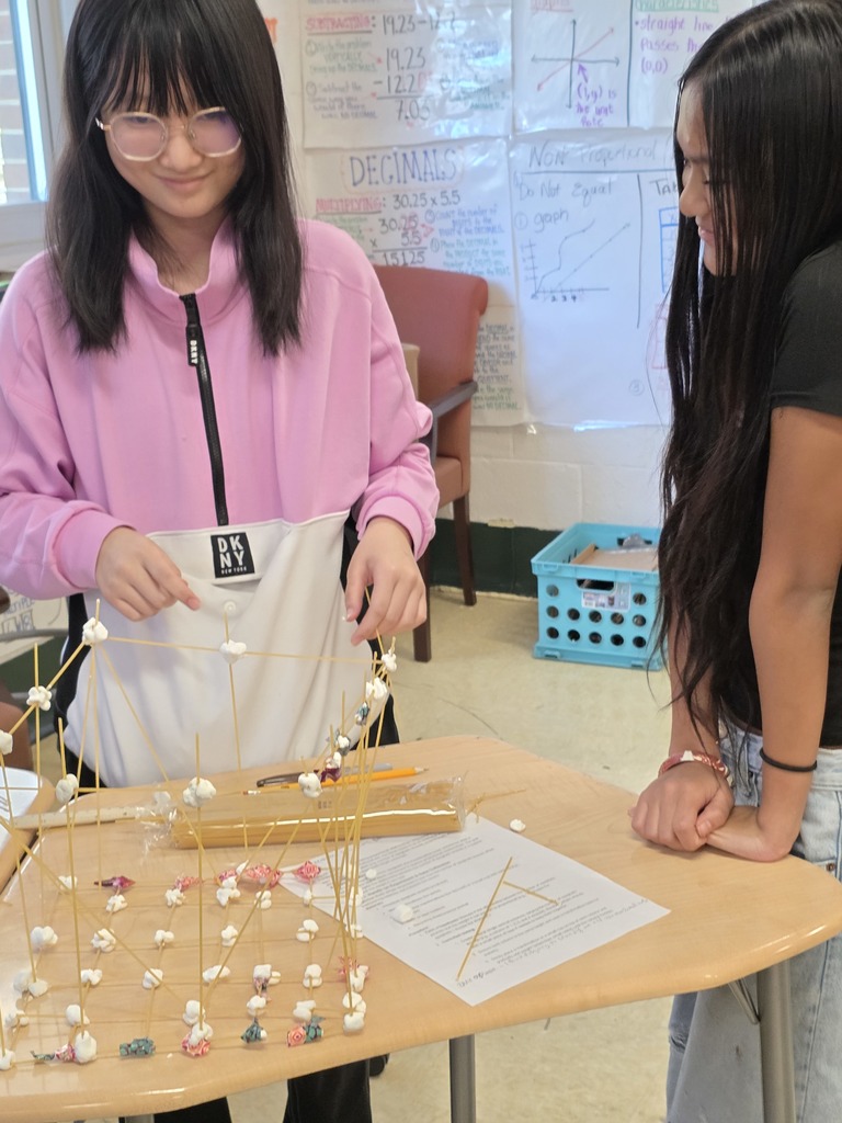 Students used spaghetti and marshmallows to design and build towers—testing how one variable proportionally affects another while applying evidence from the text to guide their decisions. The room was filled with collaboration, problem-solving, and lots of creative engineering!