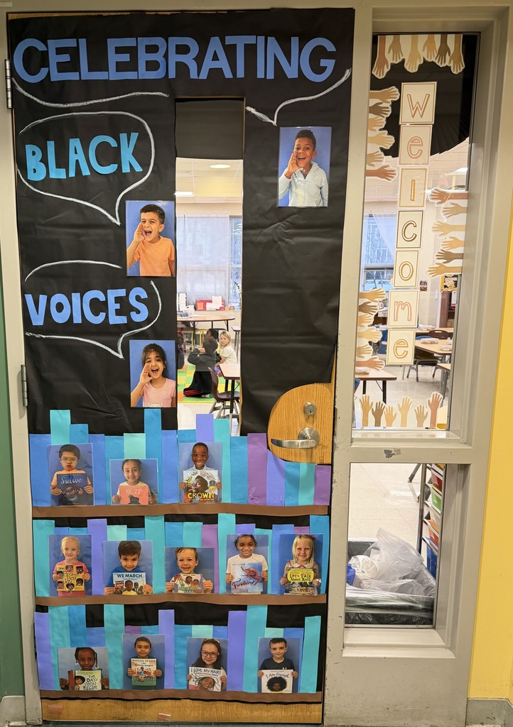 Door decorated with kids face's and celebrating Black voices