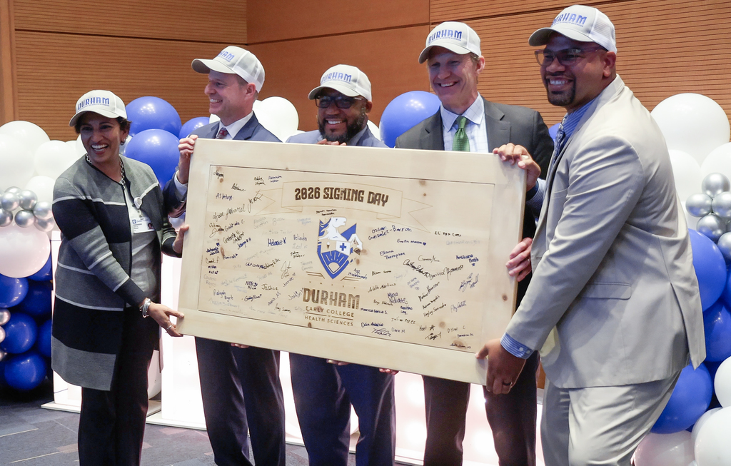 Duke Health, Durham Tech and Durham Public Schools representatives hold the 2026 Signing board.